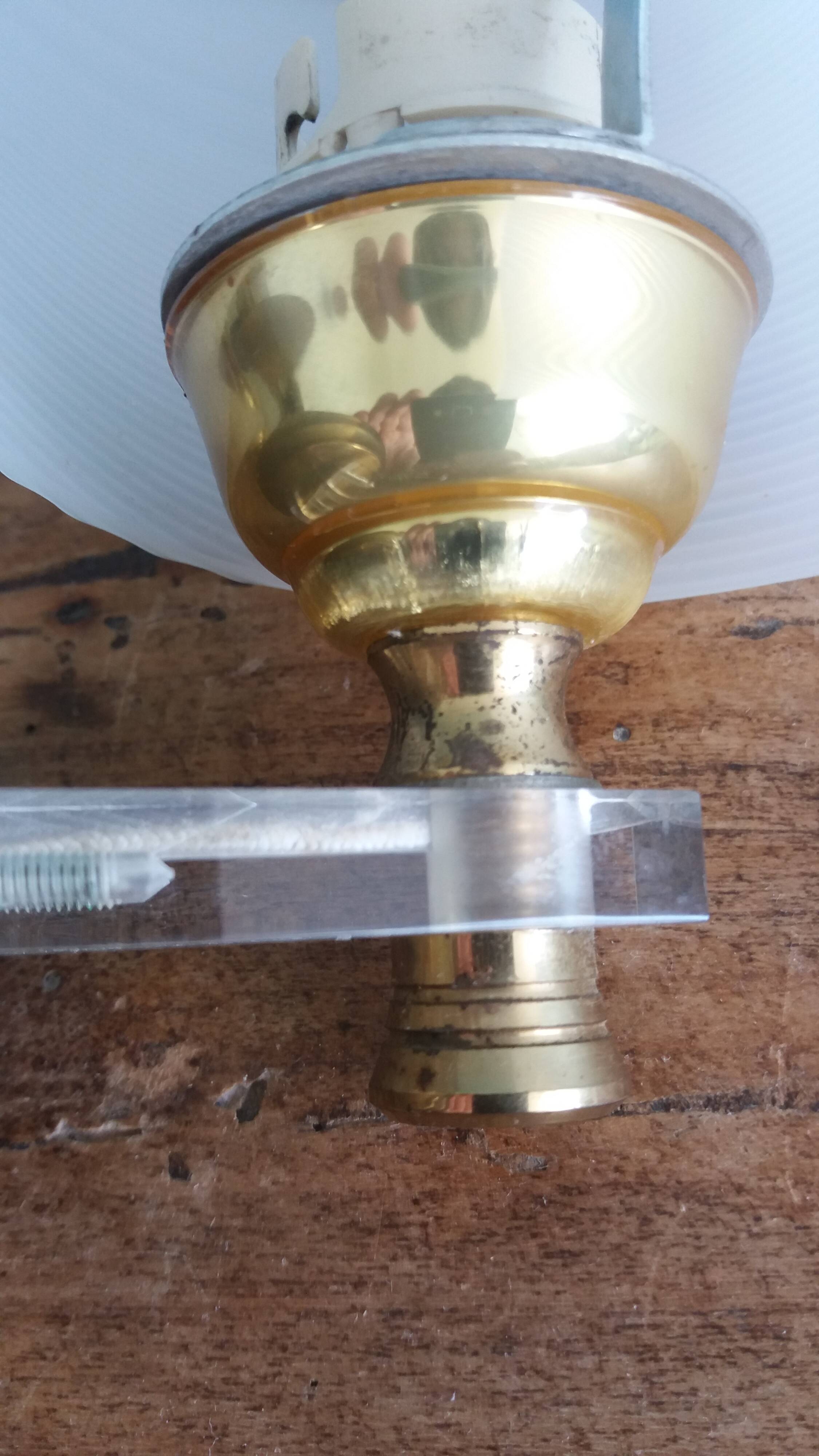 Golden metal appliques and plexiglass perspex in the style of Maison Lunel or Guariche.