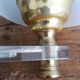 Golden metal appliques and plexiglass perspex in the style of Maison Lunel or Guariche.
