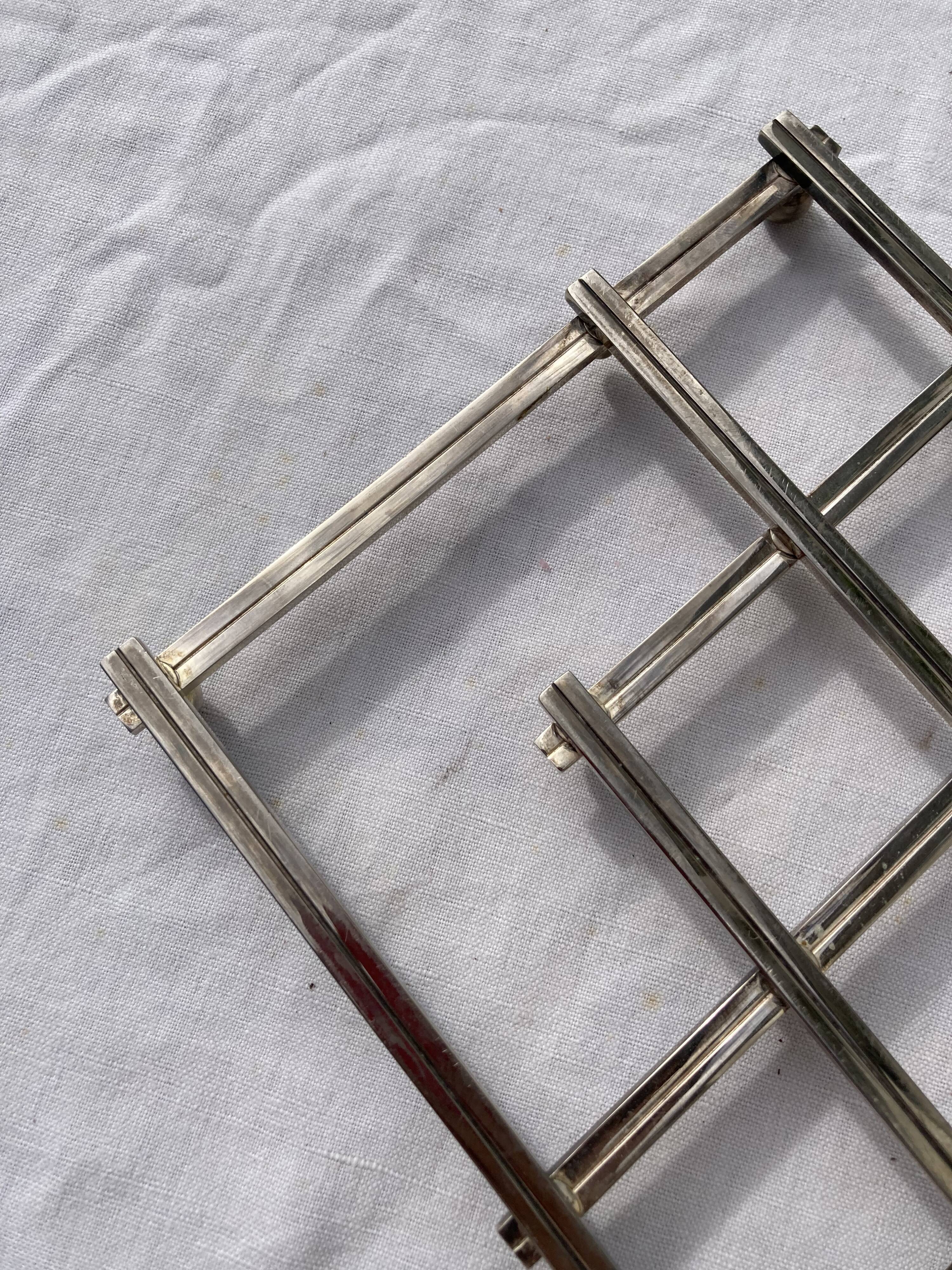 Stretch trivets in silver metal, geometric shapes