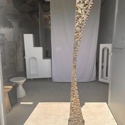 Indonesian construction element in carved wood with intertwined plant motifs mounted on a base (fri