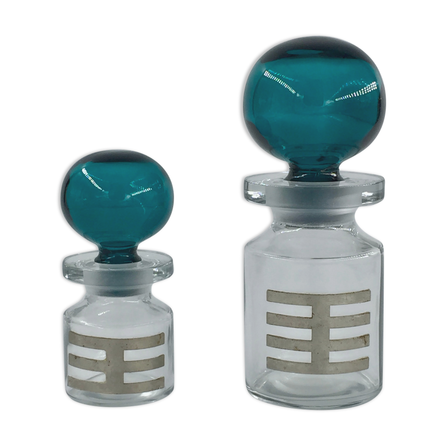 Two vintage 70s glass and metal bottles