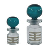 Two vintage 70s glass and metal bottles