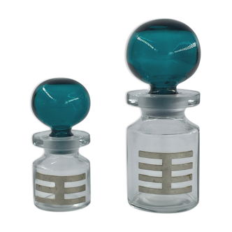 Two vintage 70s glass and metal bottles