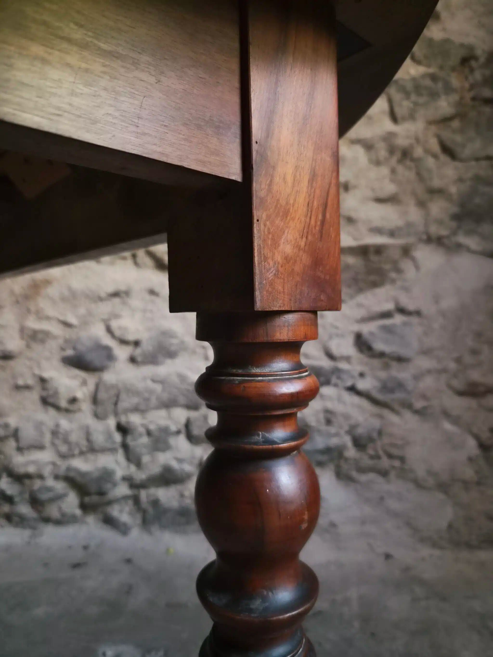 Antique drop-leaf dining table in walnut, France, circa 1900.