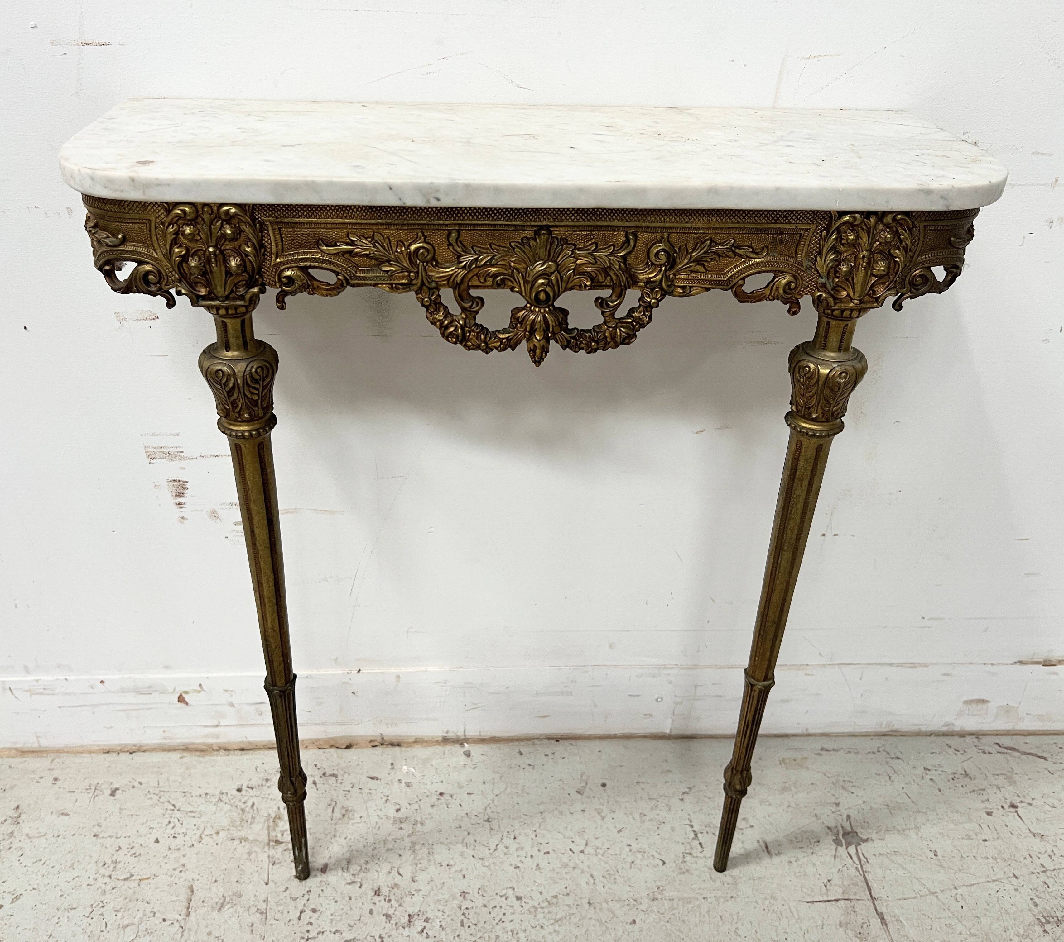 Louis XVI style console in chiselled bronze, 20th century.