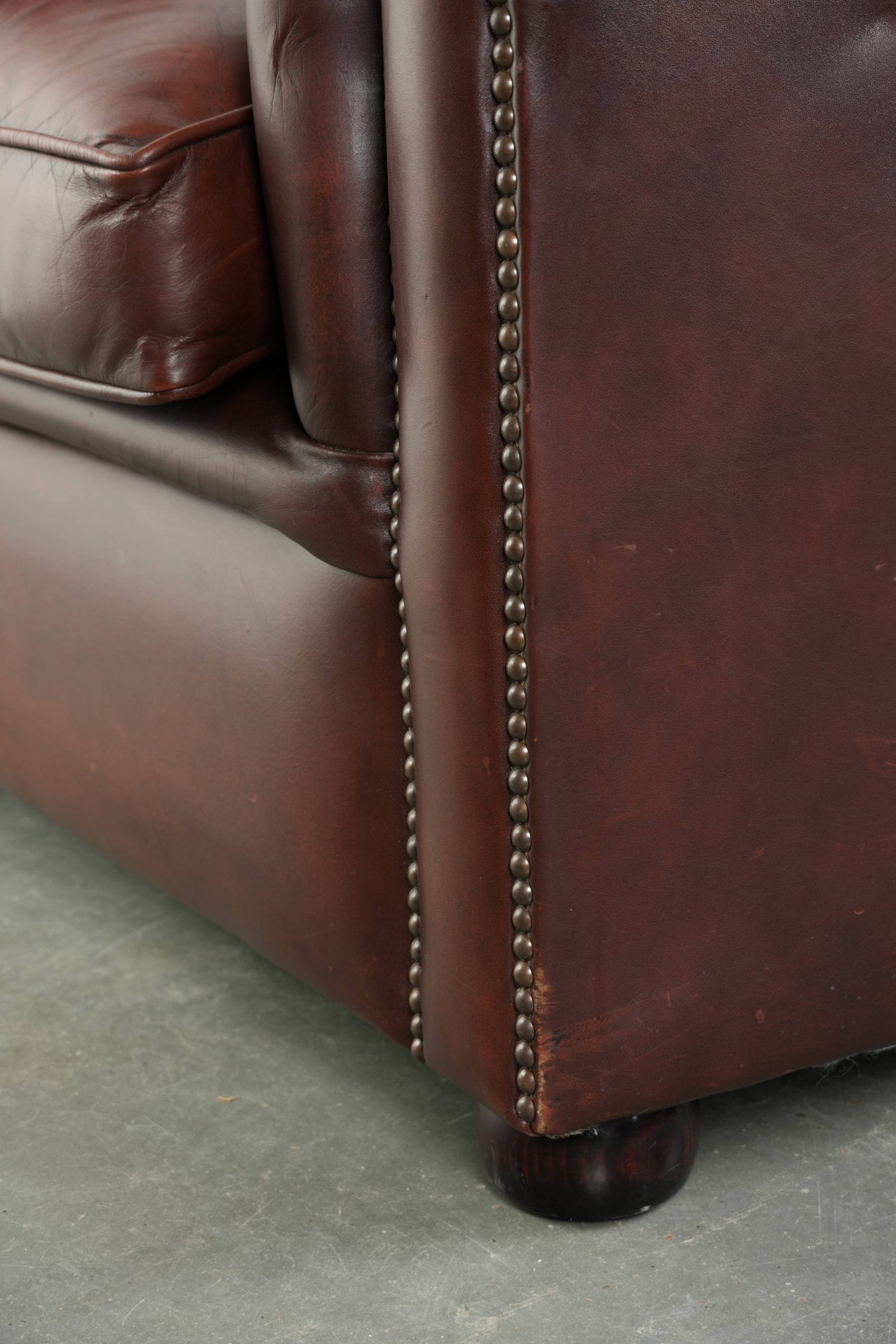 Cowhide Chesterfield armchair in a classic English style