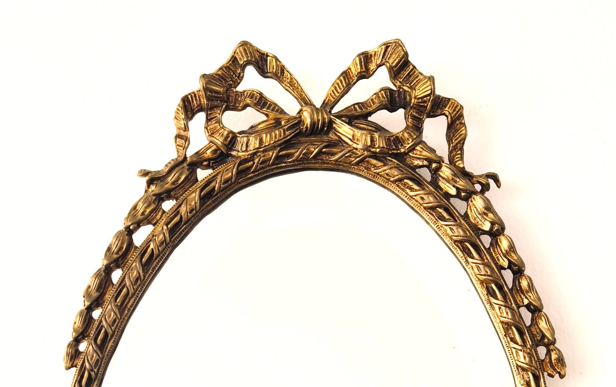Bronze mirror in Hollywood Regency style from the 1940s/50s.