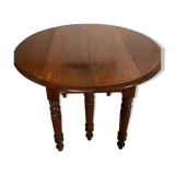 Table  ronde avec cotés rabattables