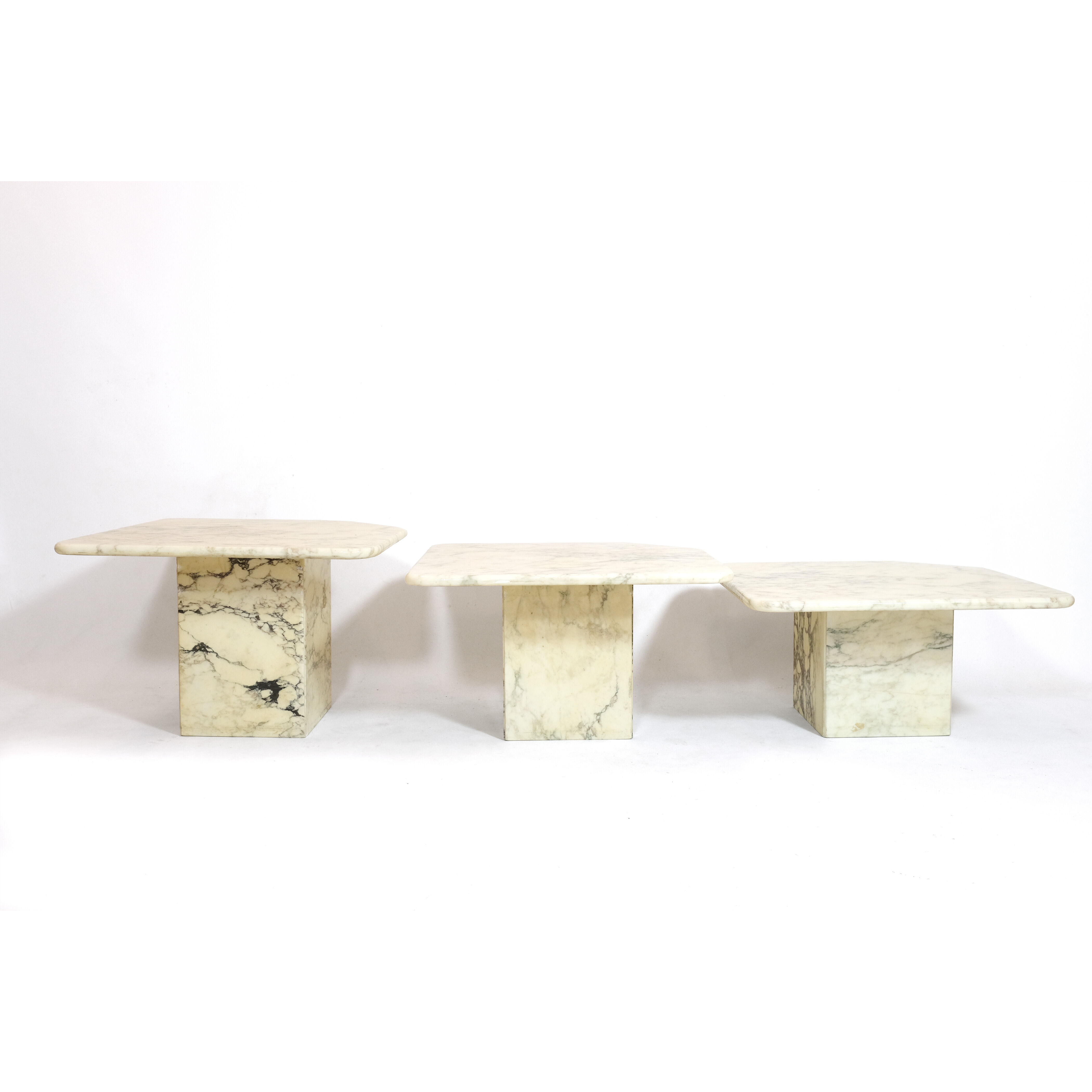 Suite of three marble trundle tables, 1970s