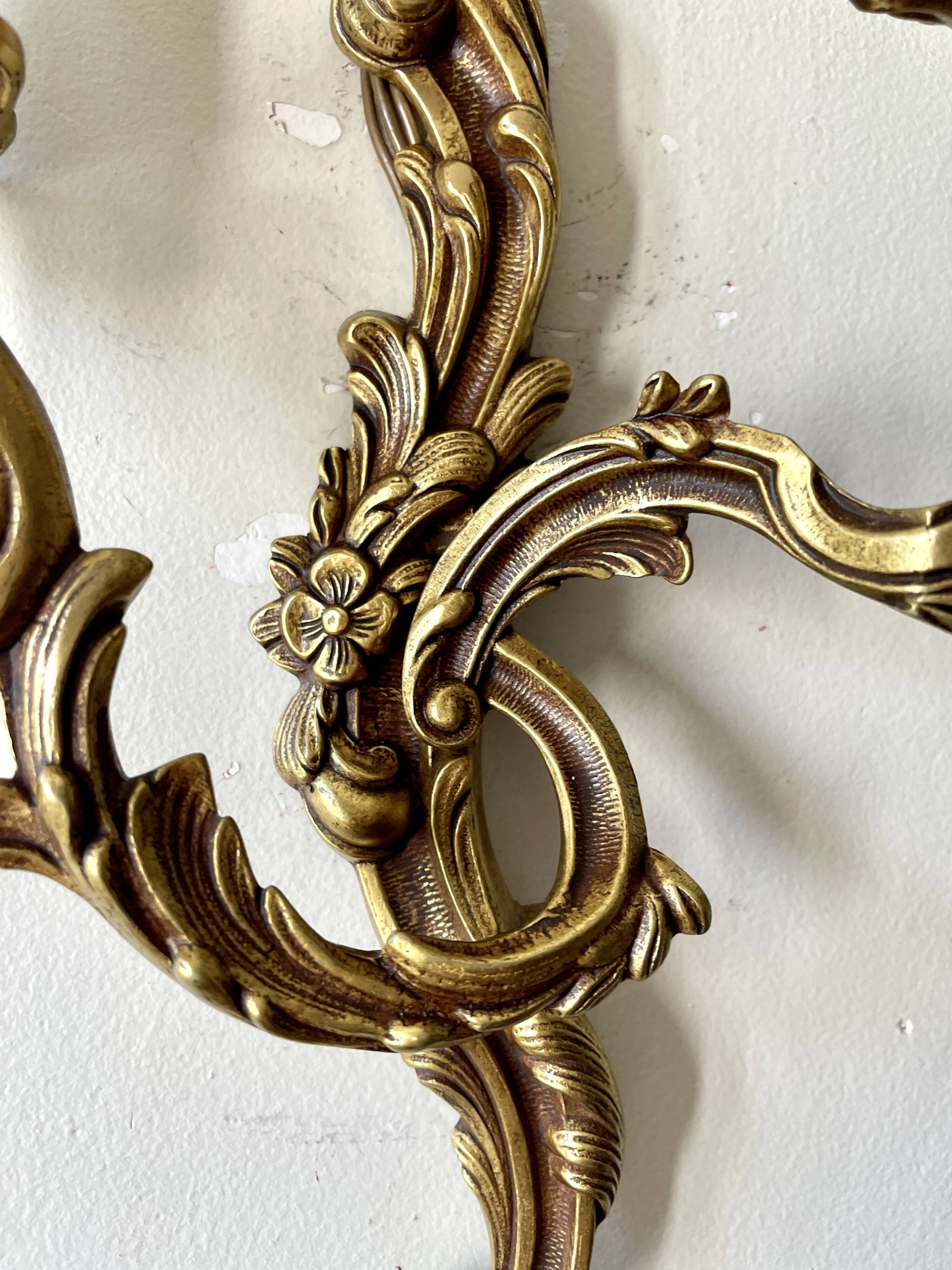 Pair of rocaille bronze wall sconces