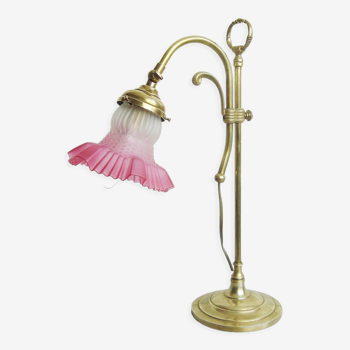 Vintage gooseneck lamp in brass with its raspberry-colored glass lampshade