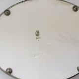 Vintage earthenware tray surrounded by antique metal