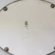 Vintage earthenware tray surrounded by antique metal