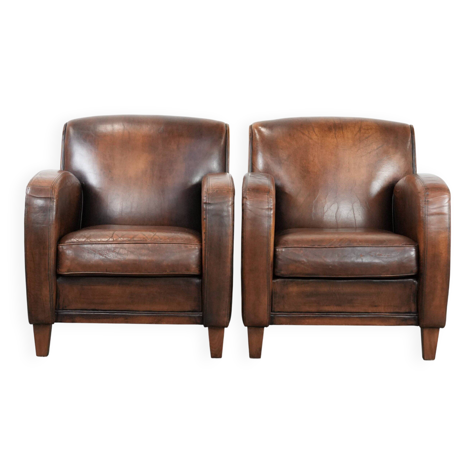Characterful set of two vintage sheepskin armchairs with beautiful colours