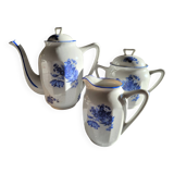 Blue and white ceramic coffee service with flowers.