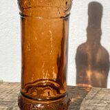 Vintage amber bottle in patterned brown glass