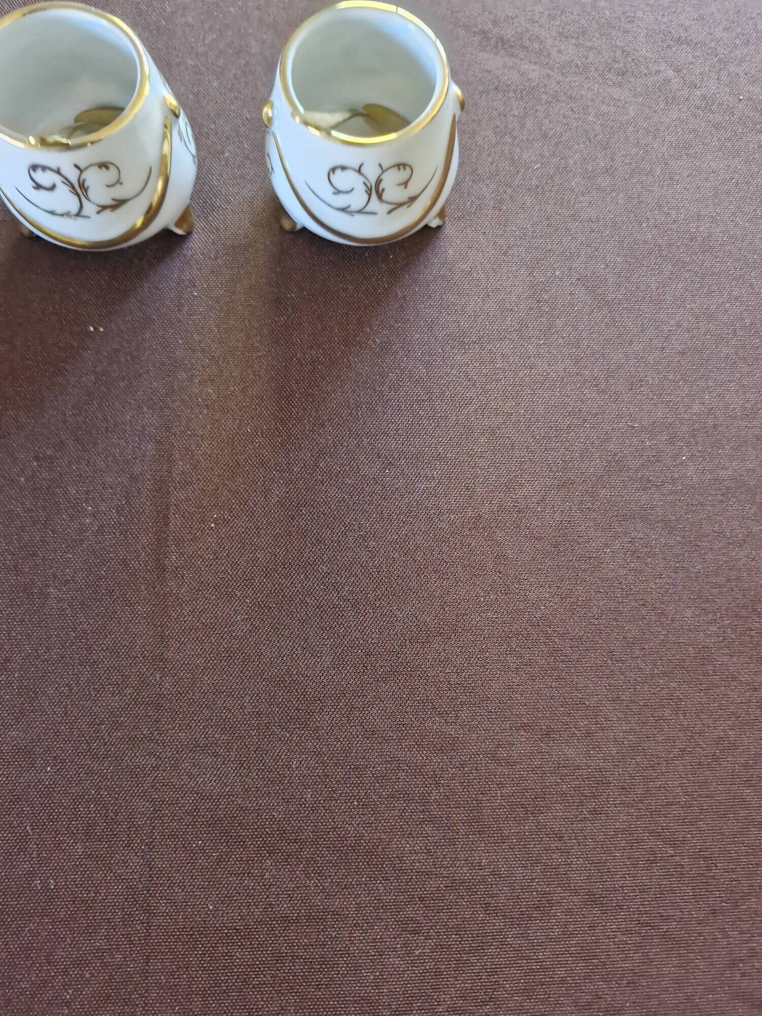Vintage porcelain salt and pepper shakers.