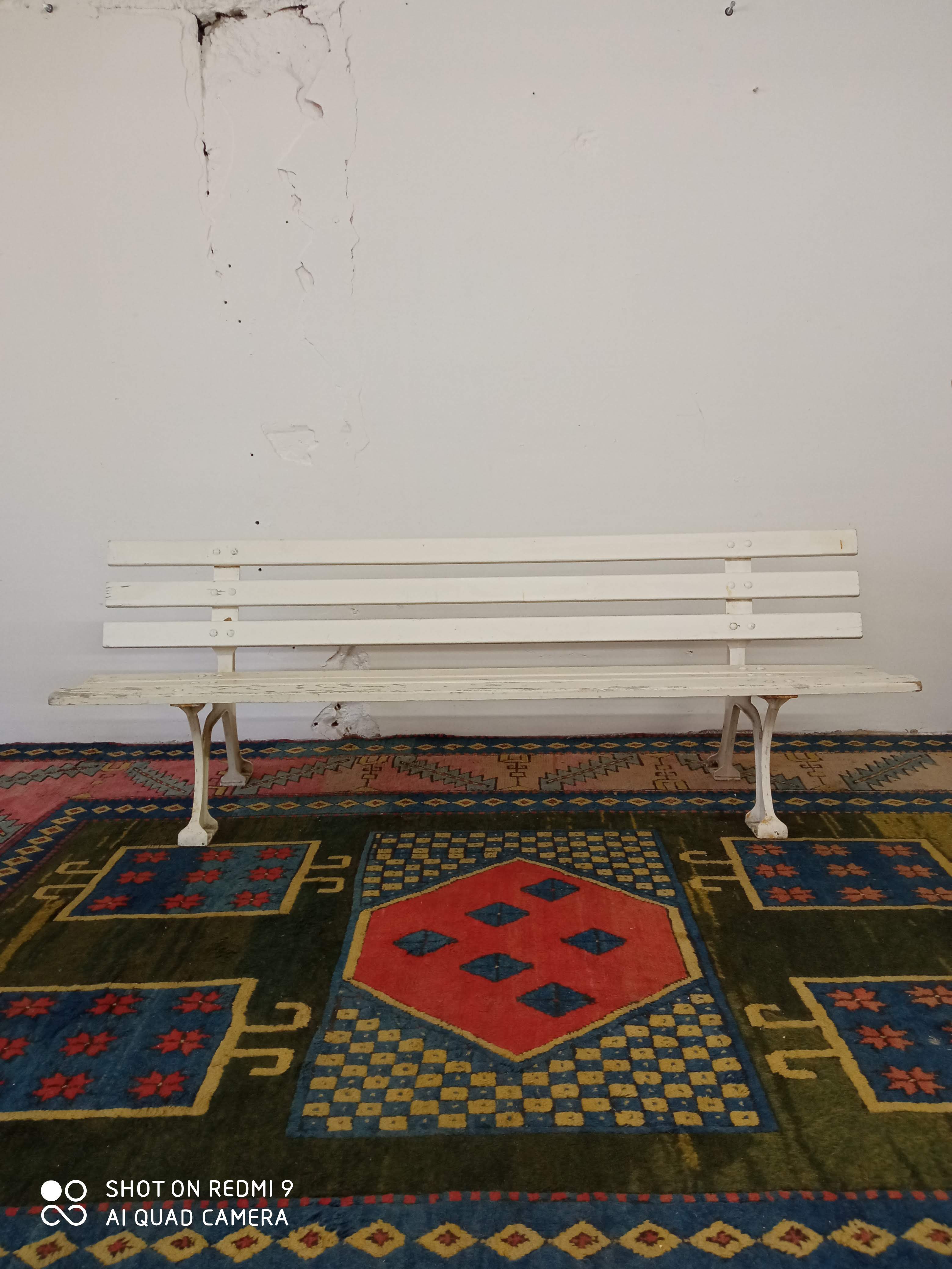 Wooden garden bench and old cast iron