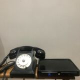 Black bakelite dial telephone with support