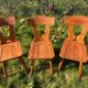 Three solid wood chairs