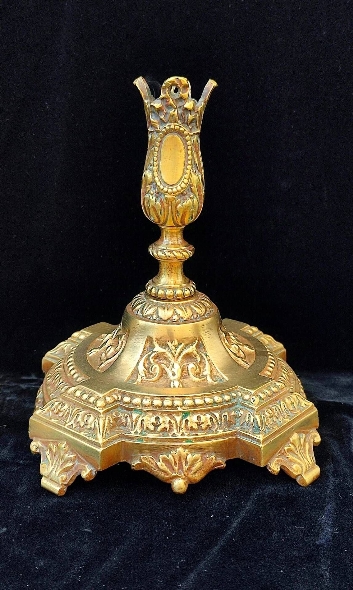 Pair of antique carved bronze candlesticks.