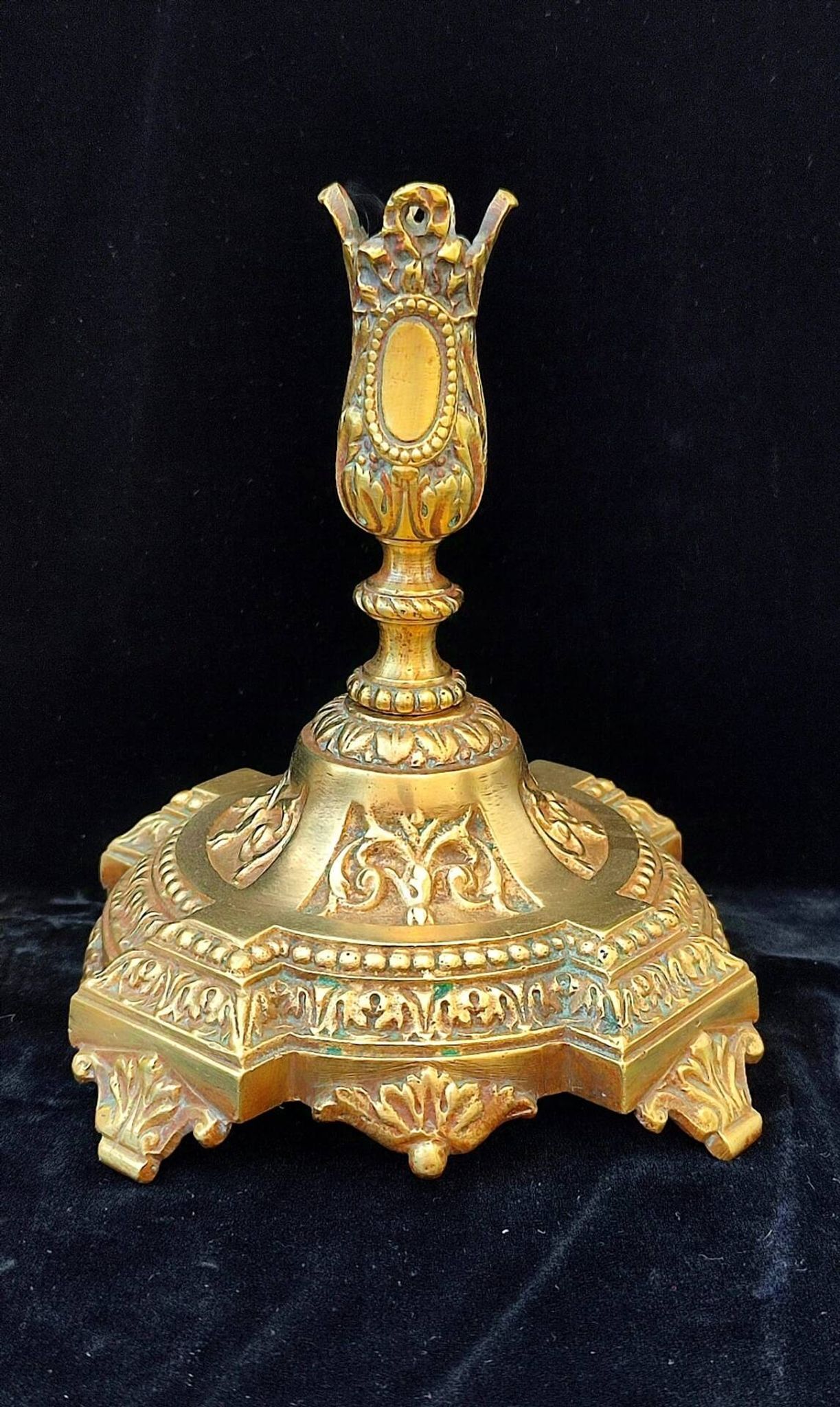 Pair of antique carved bronze candlesticks.