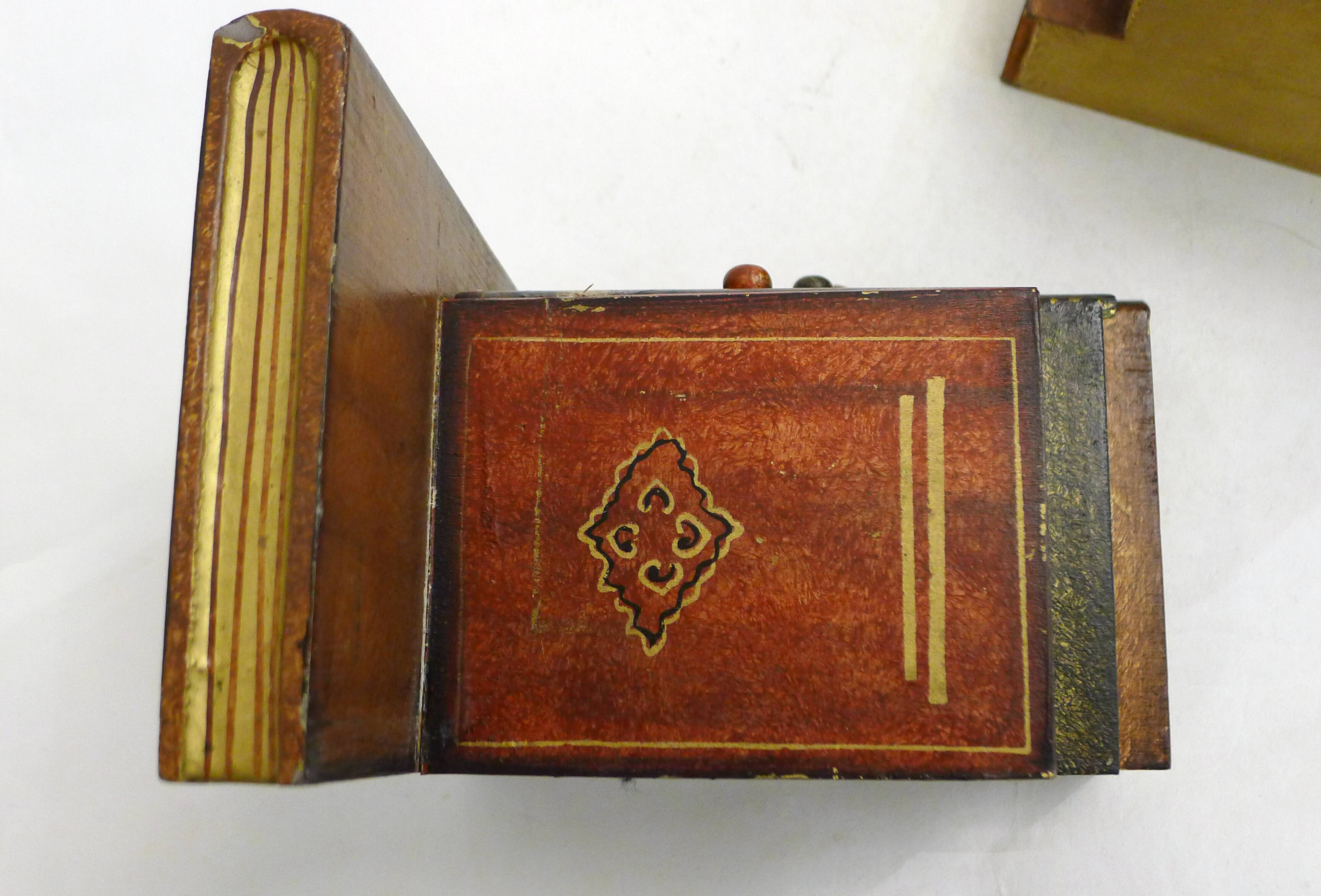 Pair of bookends (& secret boxes) in trompe l'oeil Stacked books