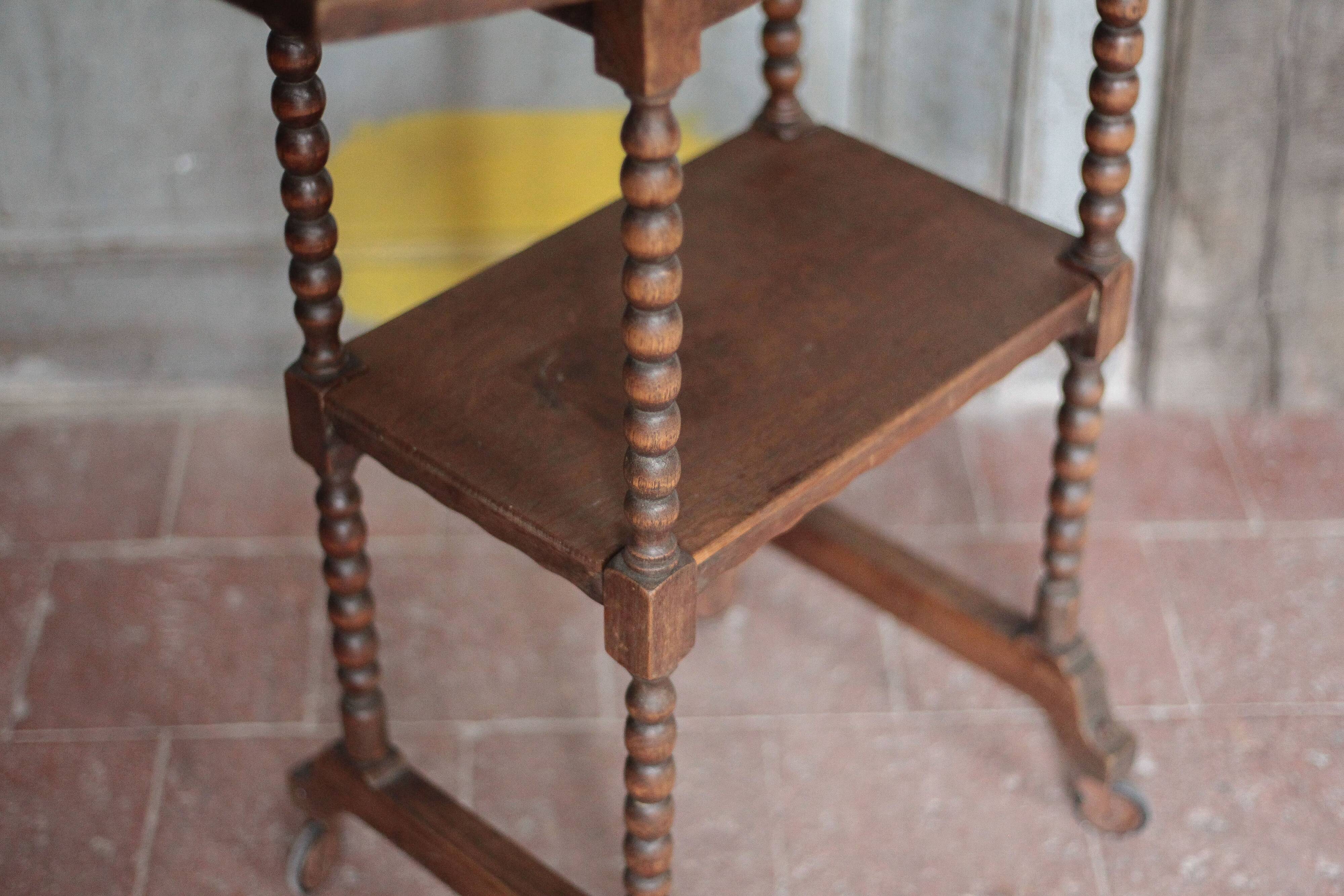 Vintage turned wood dessert trolley, wheeled table with removable top.