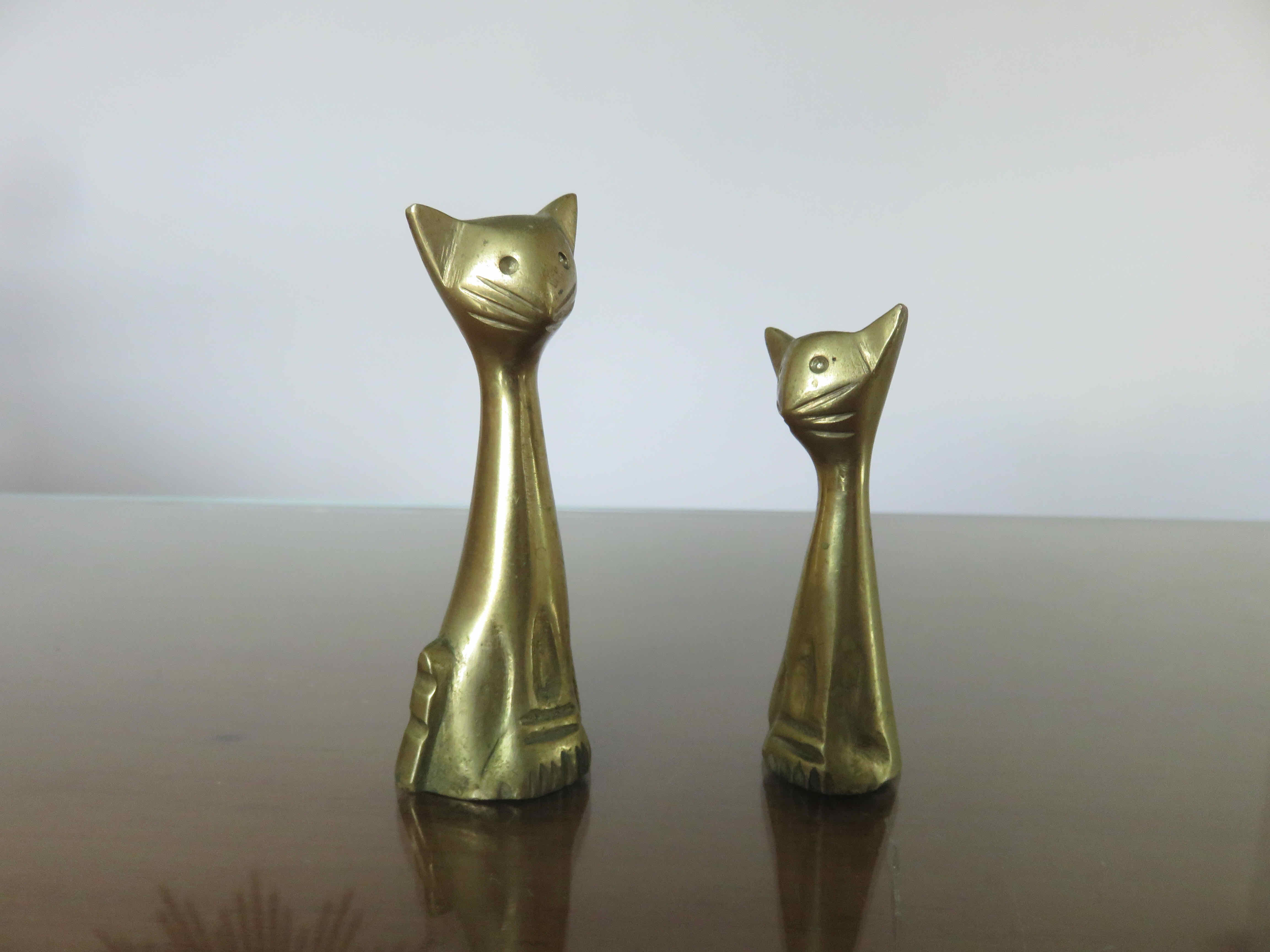 Couple of stylized cats in brass 70s