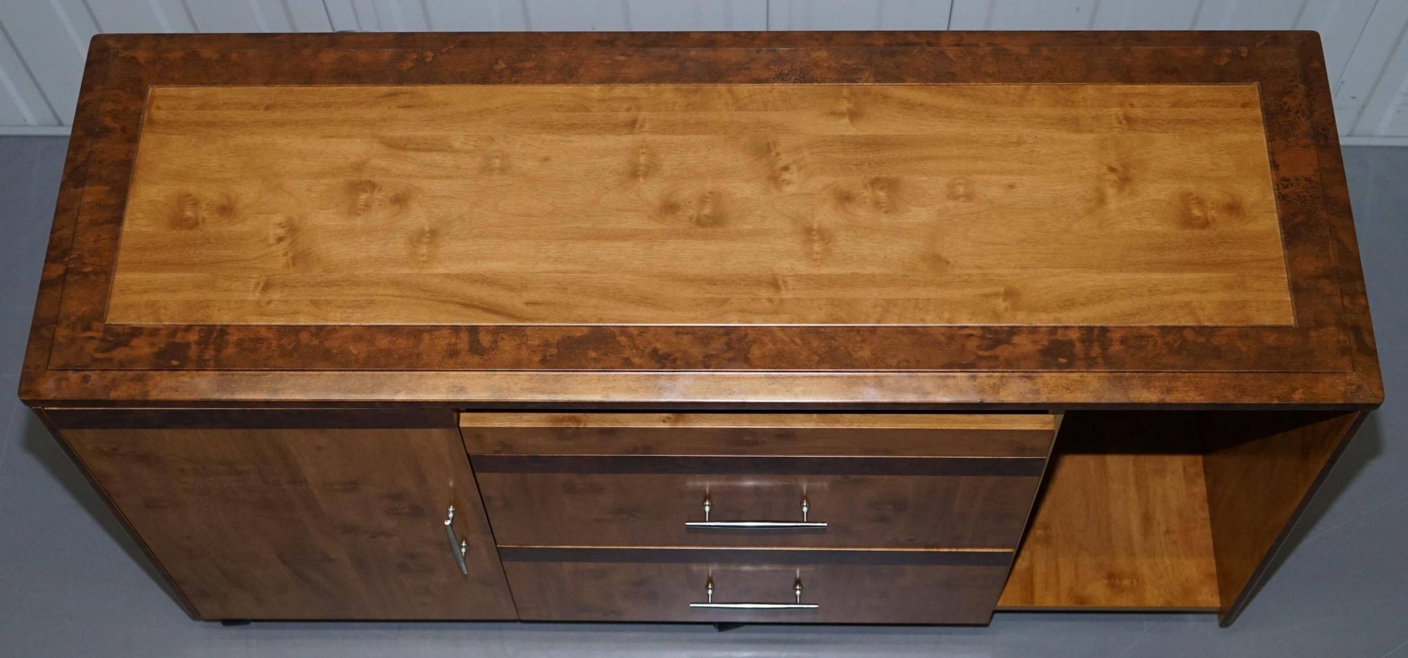 Walnut Burr buffet with drawers and wheels, part of a set.