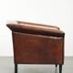 Sleek sheepskin Art Deco design armchair with black piping