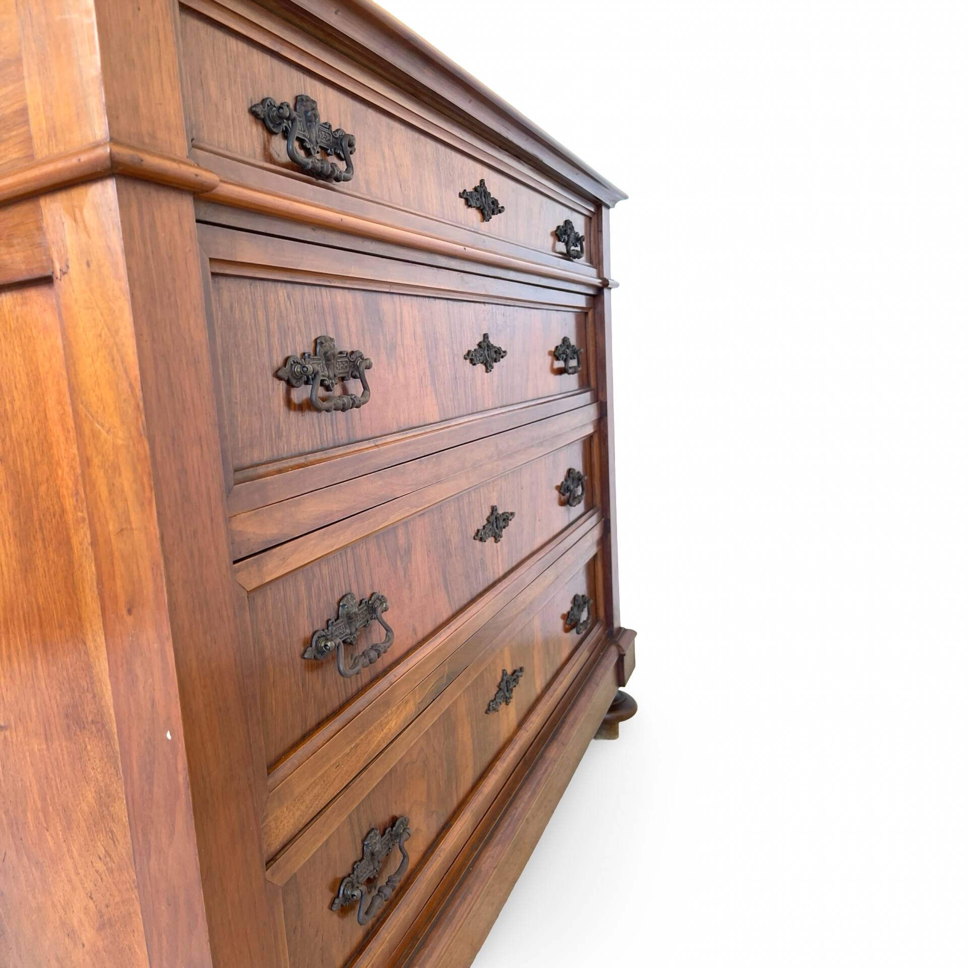 Antique walnut commode with bronze handles in the shape of a lion's mask,
