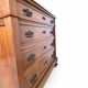 Antique walnut commode with bronze handles in the shape of a lion's mask,