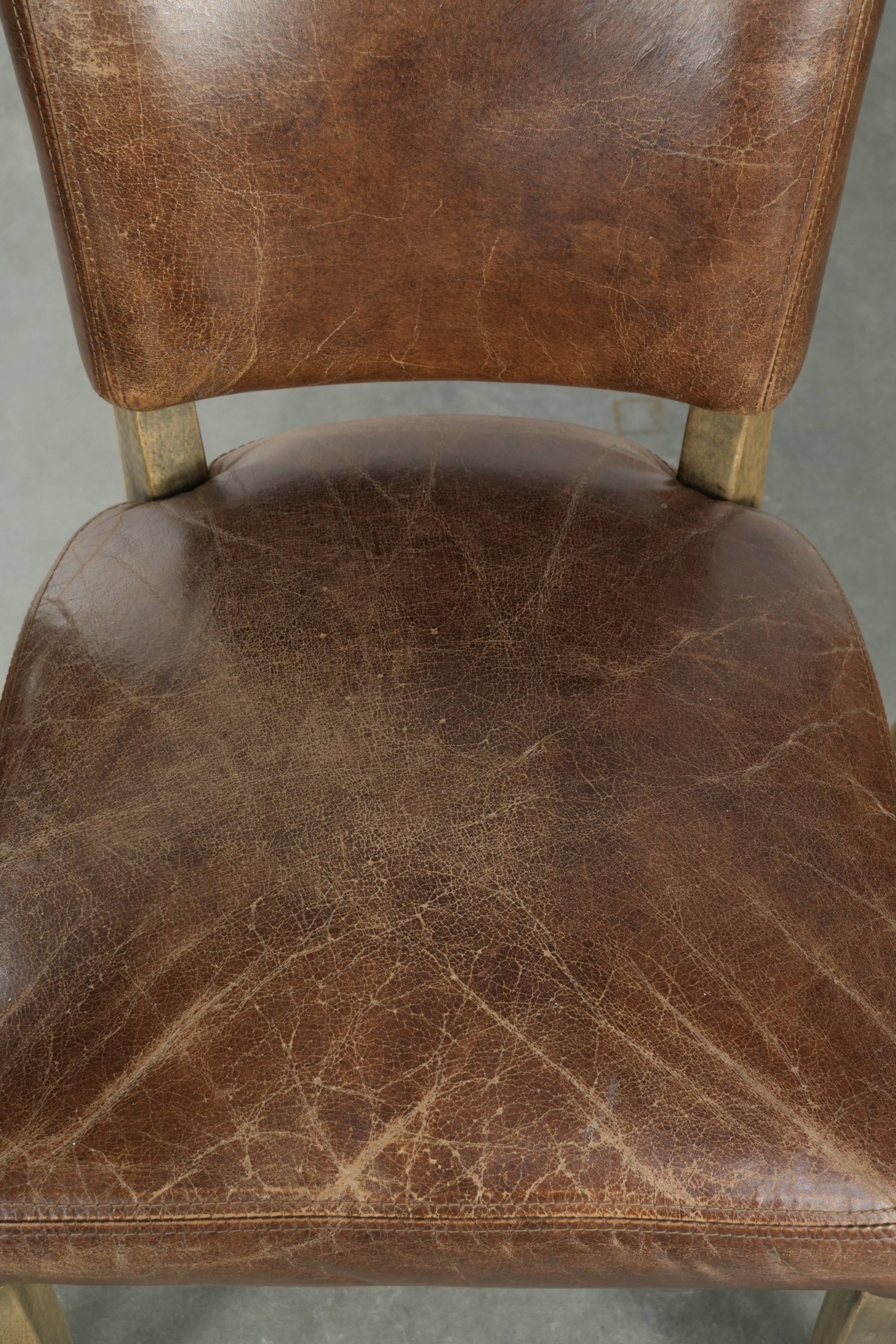 Set of 4 vintage cowhide and wooden dining chairs