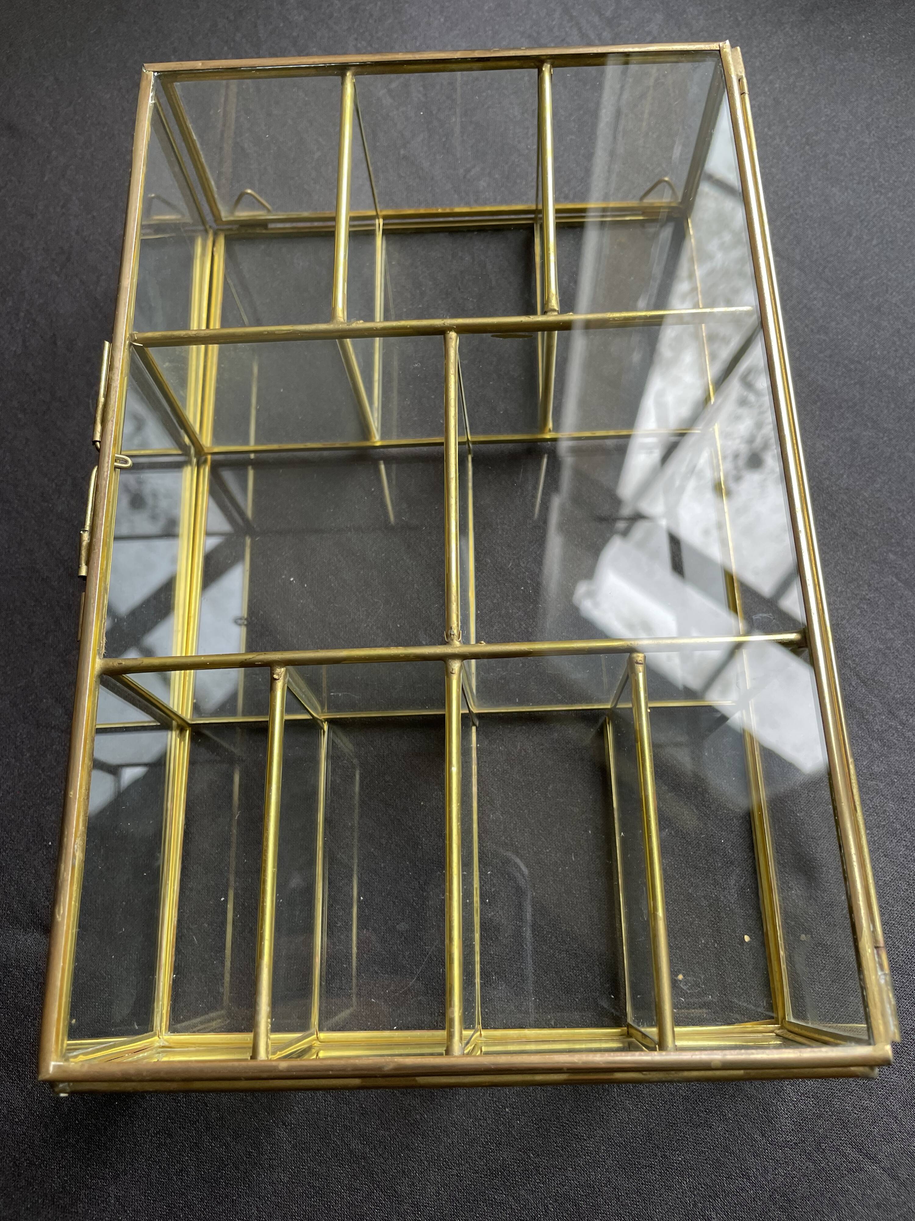 Glass and brass wall display case