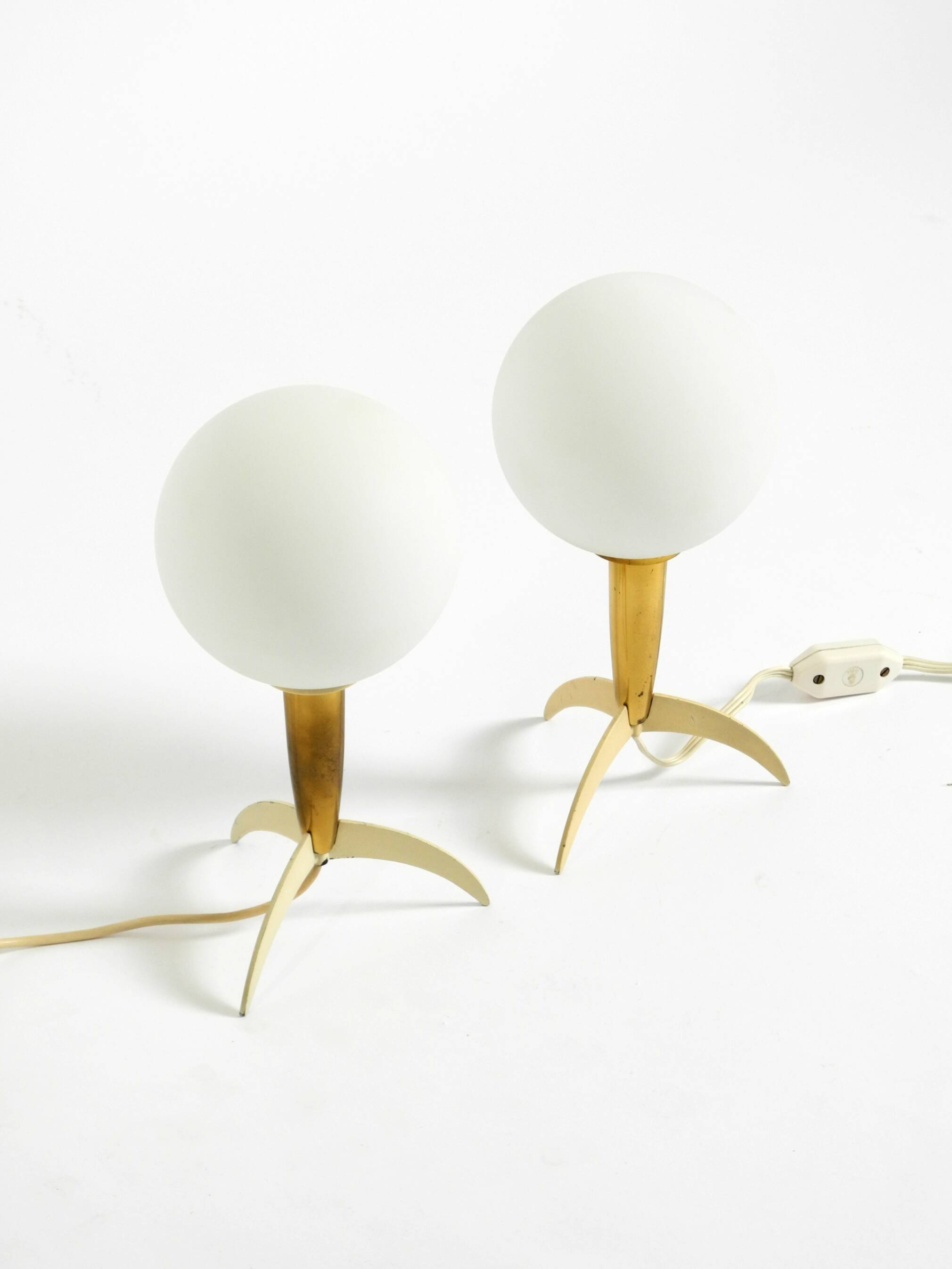 Two Mid-Century Modern rocket table lamps in brass and glass