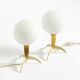 Two Mid-Century Modern rocket table lamps in brass and glass
