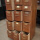 Office furniture has oak drawers 1950 brass handles and label holders