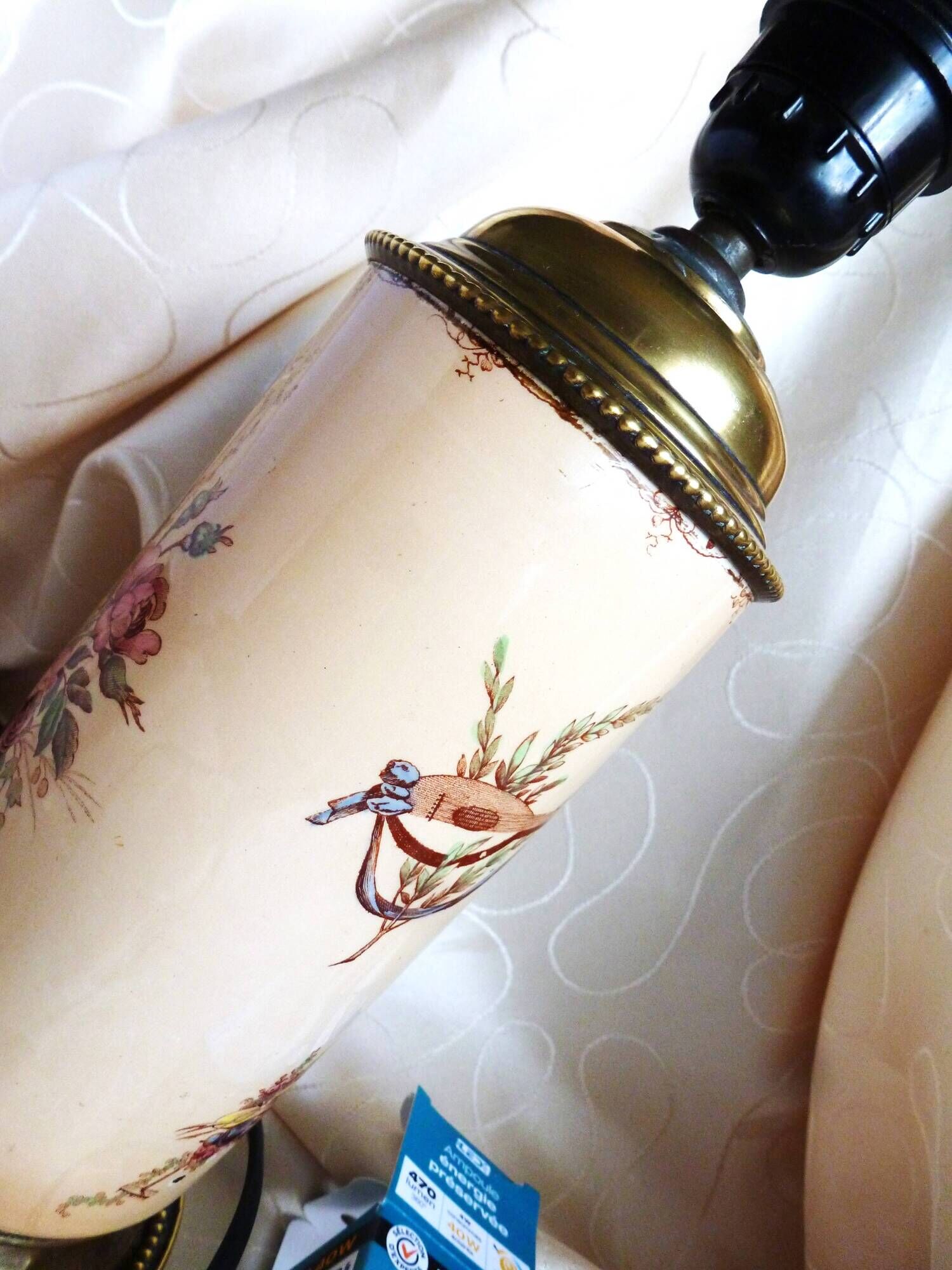Old ceramic lamp "Lunéville" with a pig bladder shade.