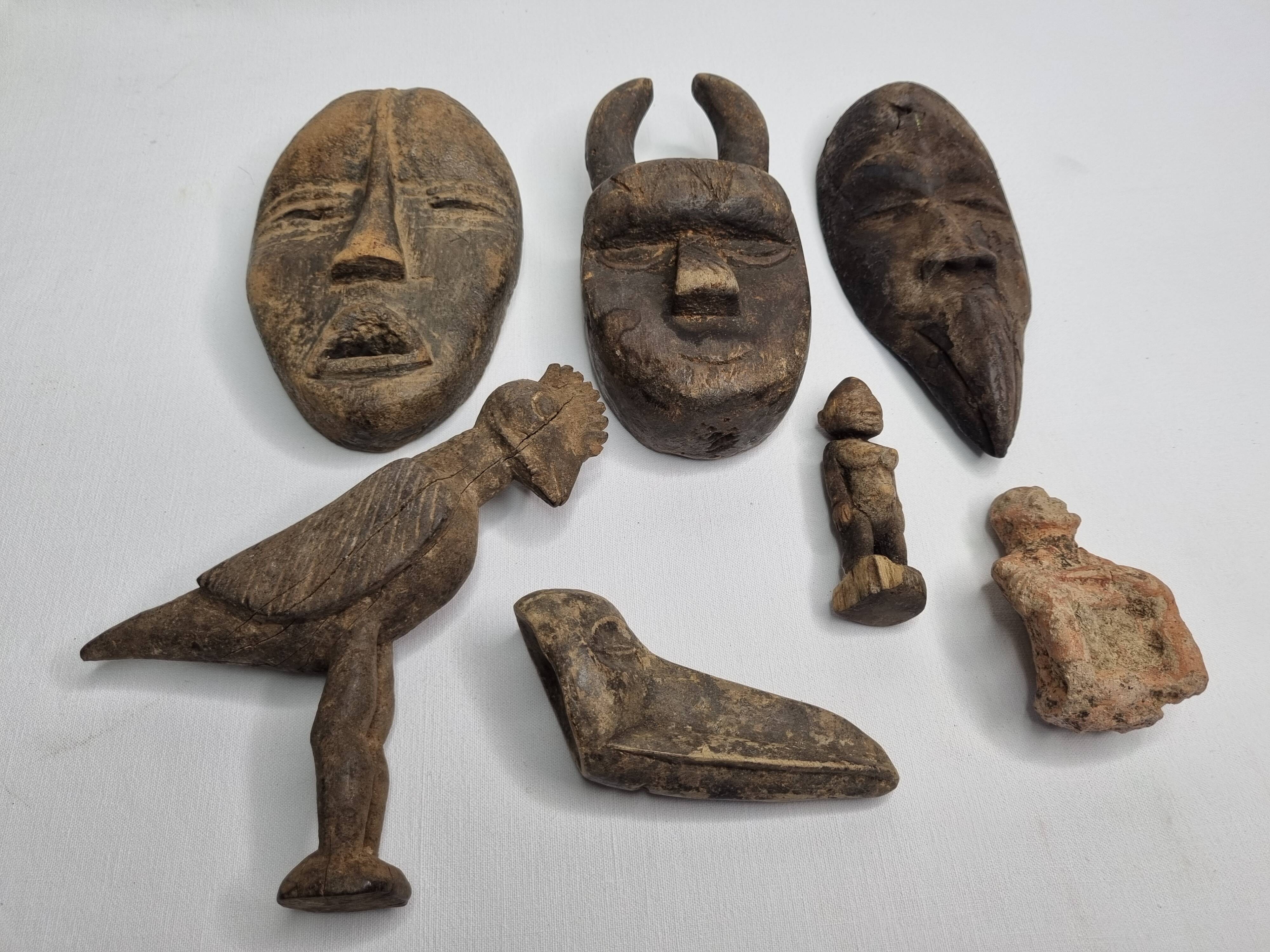 Collection of passport masks and sculptures in wood and terracotta, 7 pieces, 5 to 18 cm