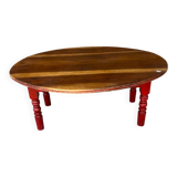 Oval coffee table in wood and red