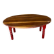Oval coffee table in wood and red