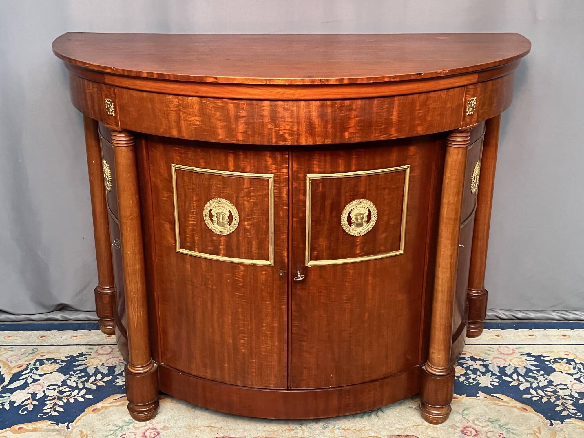 Empire style sideboard. Mahogany. Gilded bronze decoration.