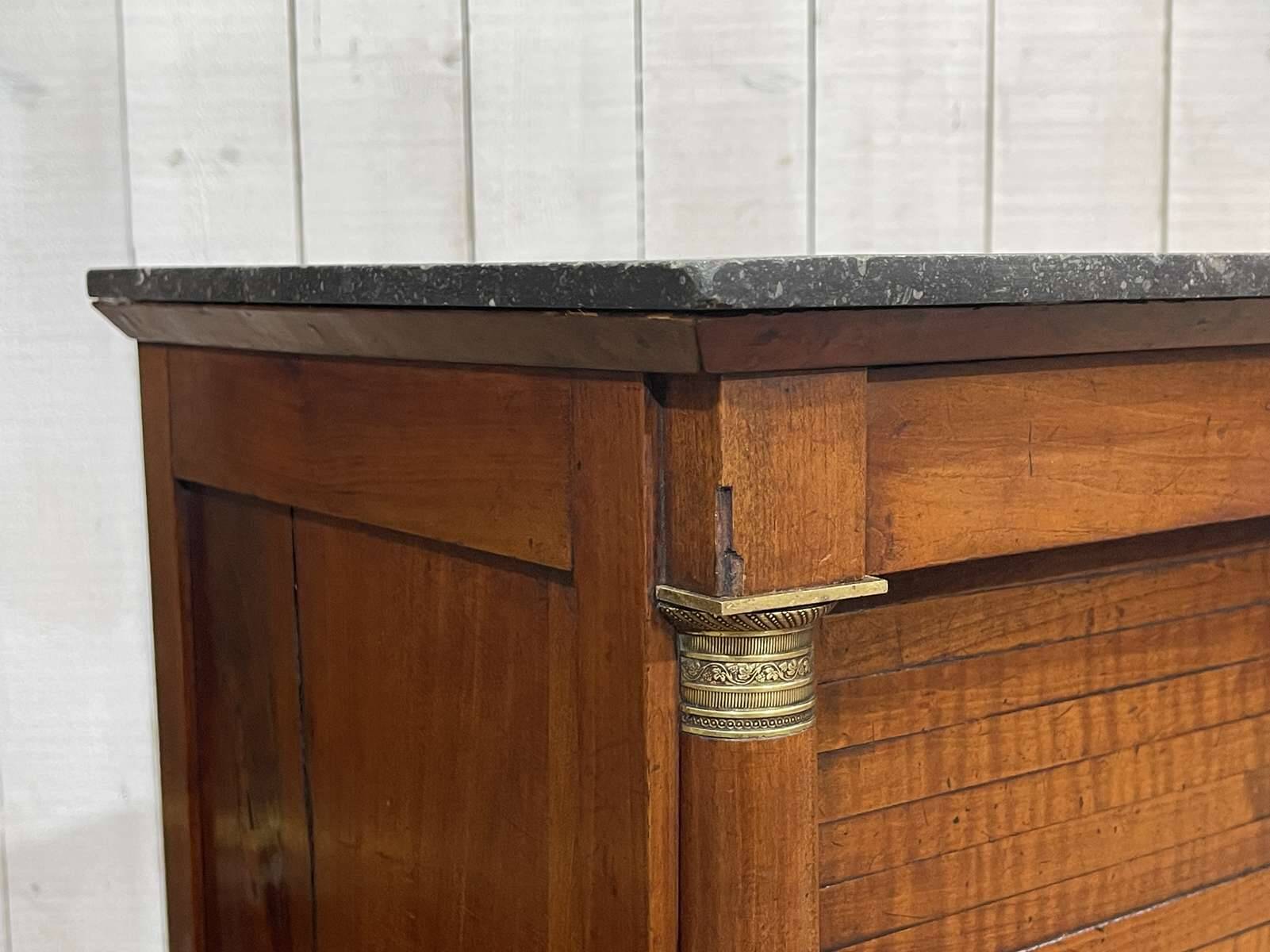 Empire bedside table from the 19th century in cherry wood and black marble.