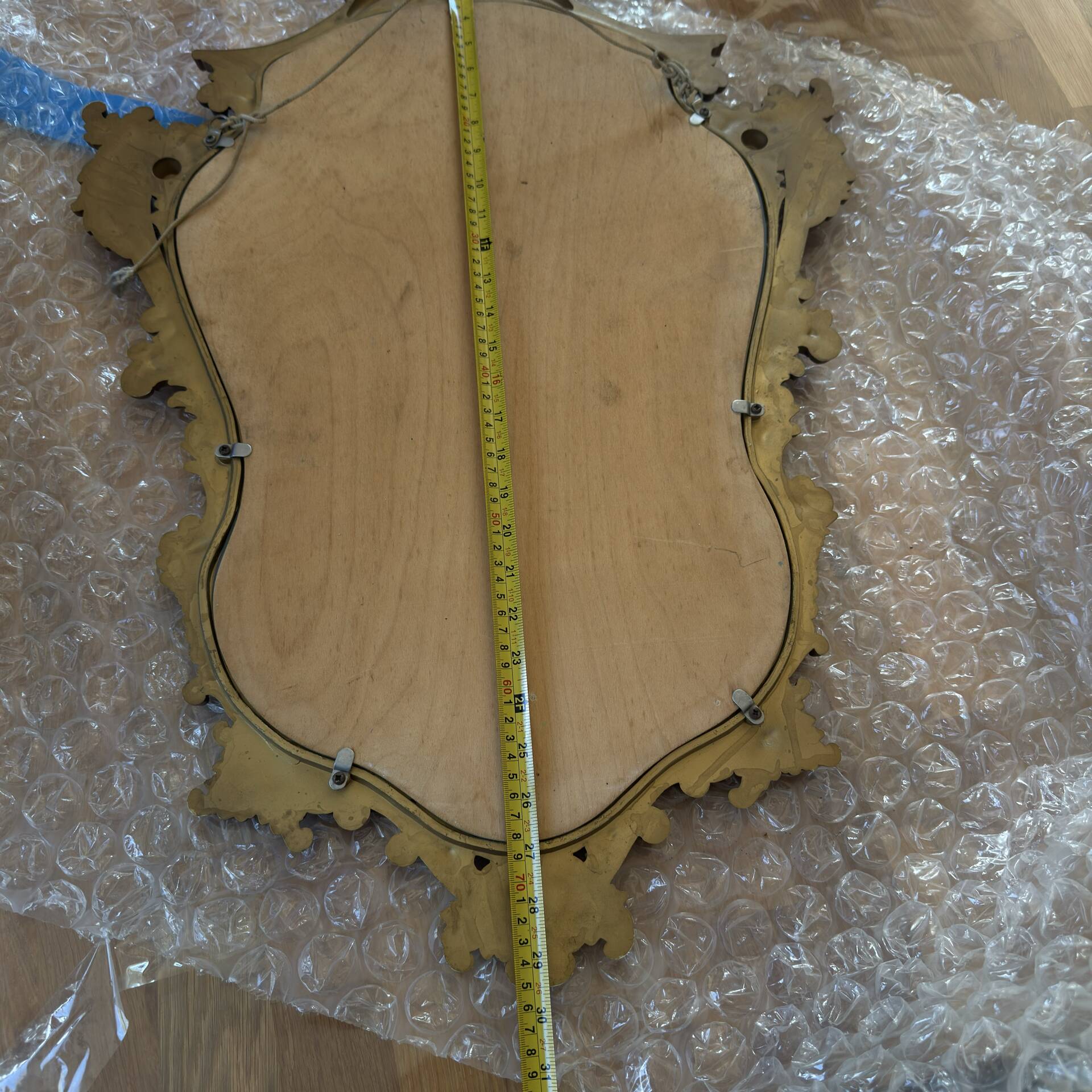 Antique mirror in Louis XV Rocaille style with carved frame.
