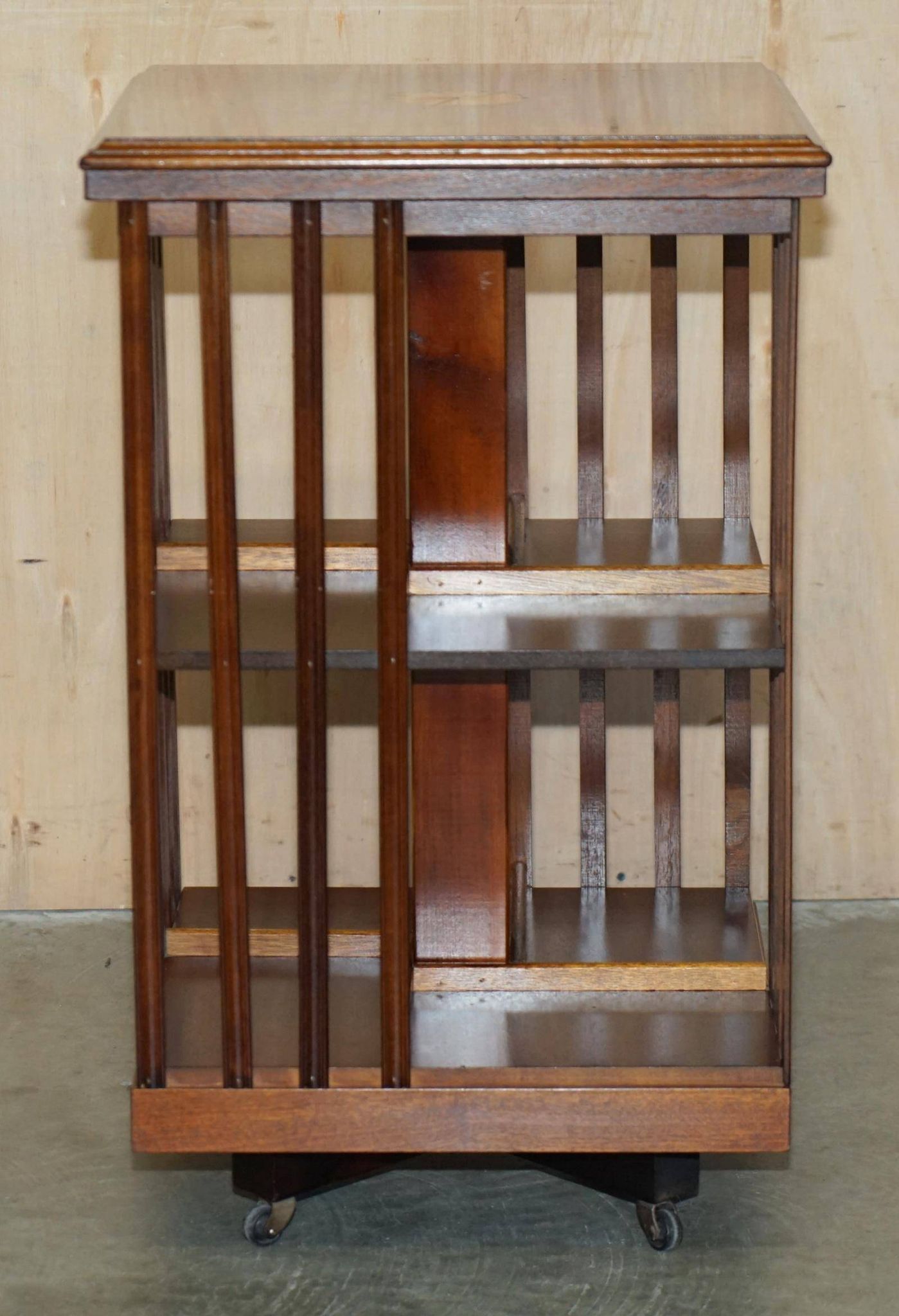 Sheraton Revival rotating library table in walnut and satin wood.