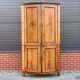 Louis Seize Oak corner cabinet with a quarter curved front