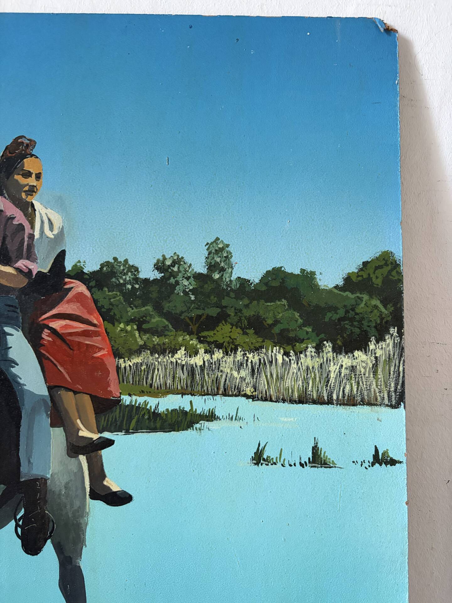 River crossing on horseback, on a sign by Campana.