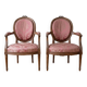 Pair of Louis XVI medallion armchairs in wood and pink fabric.