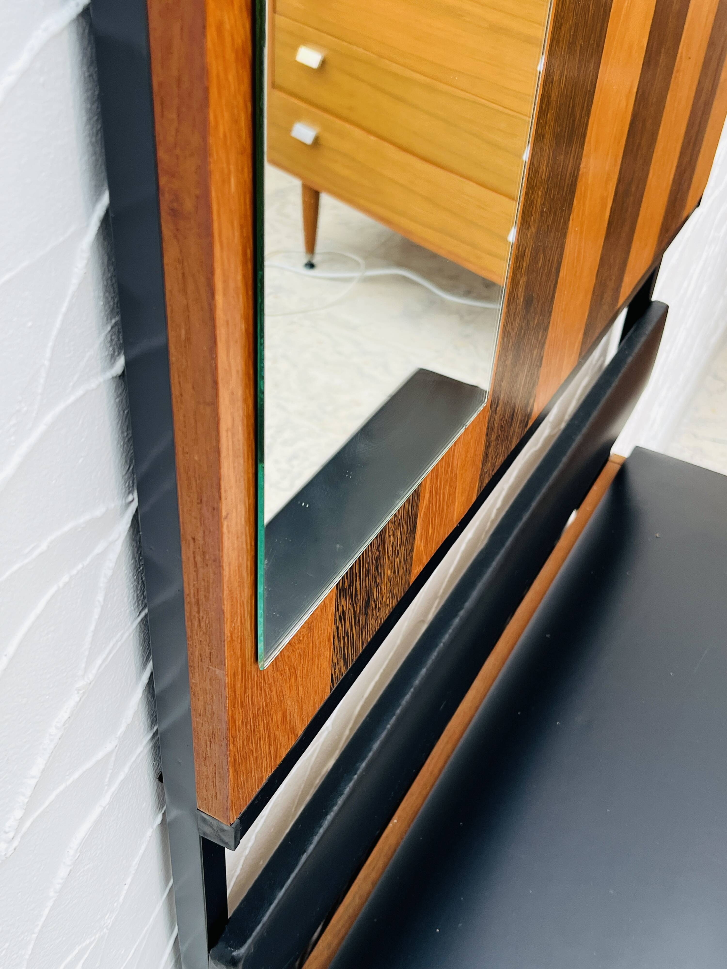 Vintage wall coat rack with storage bench from the 1970s.